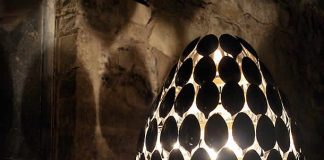 SPOON LAMP by Clive Roddy Designer Clive Roddy created the SPOON LAMP that is composed of 115 stainless steel dessert spoons.