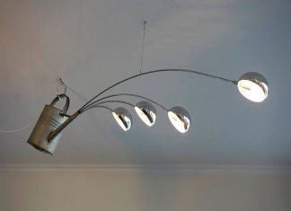André Stache took a used watering can and upcycled it together with 4 lights into an amazing pendant that looks like it sprinkles 'light' into the room. – upcycleDZINE