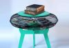 How to use a fan guard to create a multifunctional side table Fan guard side table with books