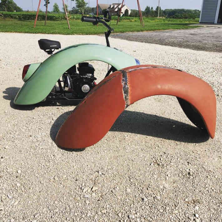 Melded together VW Beetle car fenders before and after